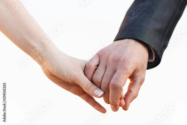 Obraz Young couple holding hands close up