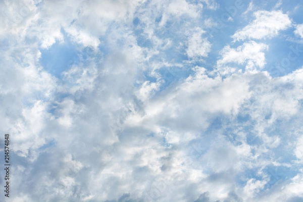 Obraz Beautiful sunlit clouds in the blue sky