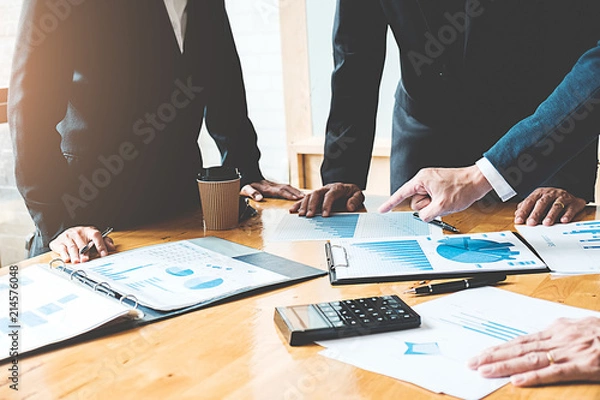 Fototapeta Business concept. Business people discussing the charts and graphs showing the results of their successful teamwork.