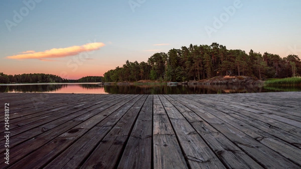 Obraz Midsummer sunset from a pier, in Finland.