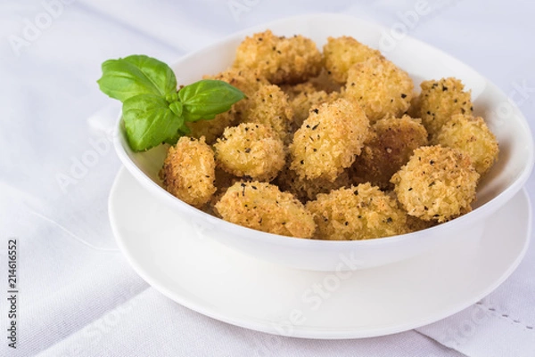 Obraz Baked crispy potato gnocchi with bread crumbs.