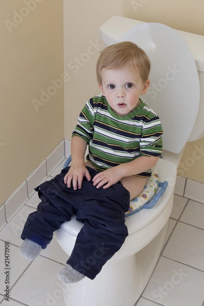 Obraz Young Boy Sitting on Toilet