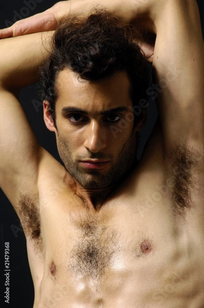 Obraz young sensual man on a black background