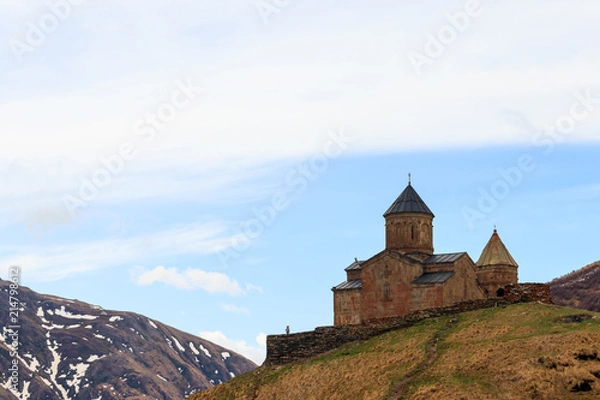 Fototapeta Gergeti Trinity Church (Tsminda Sameba), Holy Trinity Church near the village of Gergeti in Caucasian mountains, Georgia