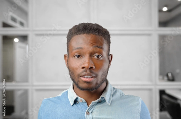 Fototapeta handsome man very tired, worried and unhappy isolated on background
