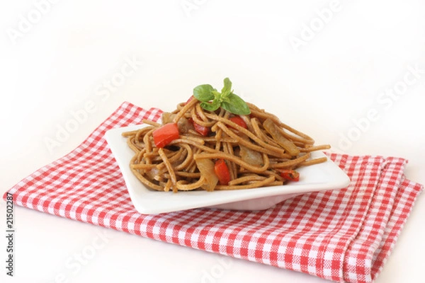 Fototapeta Fried noodles with vegetables and basil