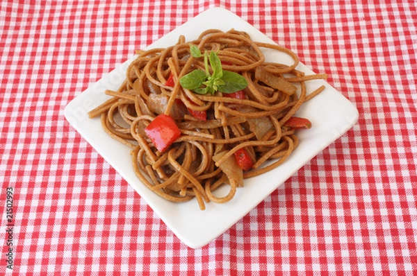 Fototapeta Fried noodles with vegetables and basil