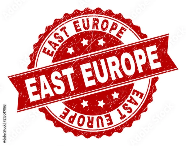 Fototapeta EAST EUROPE seal print with distress texture. Rubber seal imitation has round medallion shape and contains ribbon. Red vector rubber print of EAST EUROPE title with unclean texture.