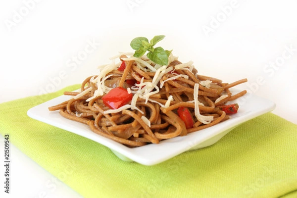 Fototapeta Fried noodles with vegetables and basil