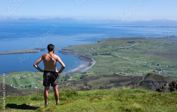 Fototapeta Man Standing at Cliff on Quiraing Trail in Summer Skye Scotland UK