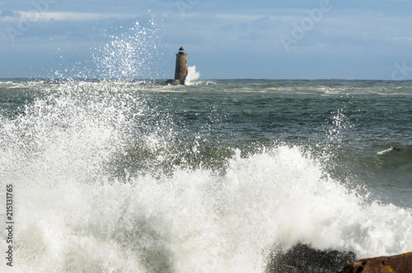 Obraz Unique High Tide Causes Large Waves Breaking Around Shore Near Maine Lighthouse