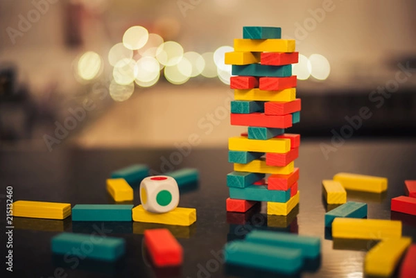 Fototapeta Jenga. Set of tower game. Wooden stack block toy. Business risk concept with wood jenga game.Businessman manage his strategy.
