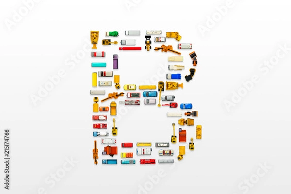 Fototapeta English letters formed by arrangement of Car toy diecast on the white background , Top view