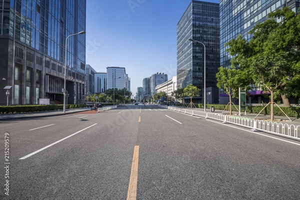 Fototapeta Panoramic skyline and modern business office buildings with empty road,empty concrete square floor