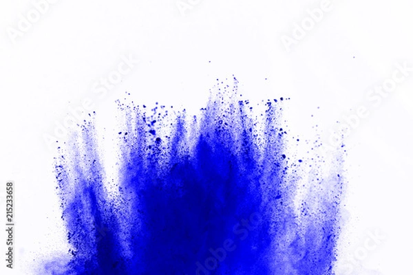 Fototapeta Abstract of blue powder explosion on white background. Blue powder splatted isolate. Colored cloud. Colored dust explode. Paint Holi.