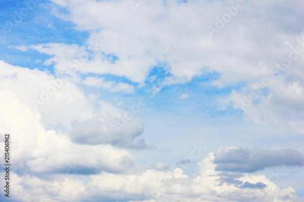Fototapeta Clouds in Blue Sky Summer Nature Wallpaper. Fluffy Sky Background Cloudscape with Many Stormy Clouds. Scenic View of Blue Pale Light Sky, Cloudy Weather Climate Image.