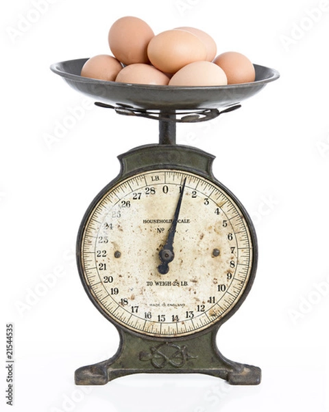 Fototapeta eggs on an old scale set