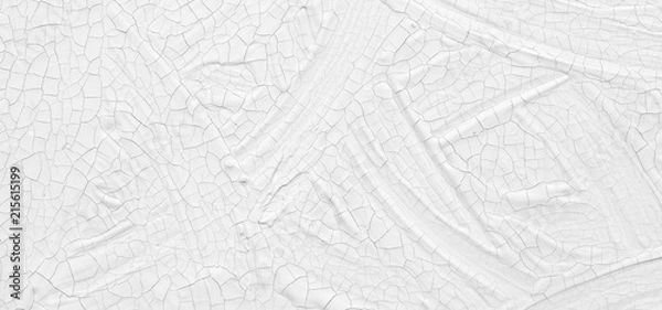 Fototapeta The texture of the paint is white. The background is drawn with a brush with a divorce on the wall.