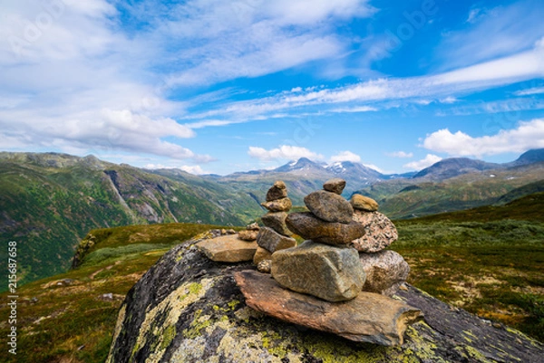 Fototapeta Stacked stones in the mountains in Norway along the Tindevegen