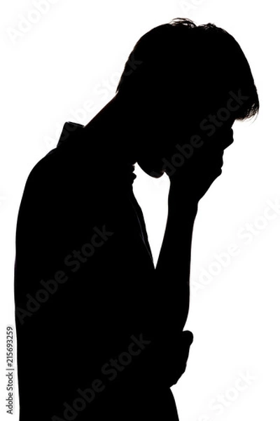Obraz silhouette of a upset boy on a white isolated background, man face profile