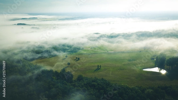 Obraz Misty sunrise over countryside path Aerial view Latvia