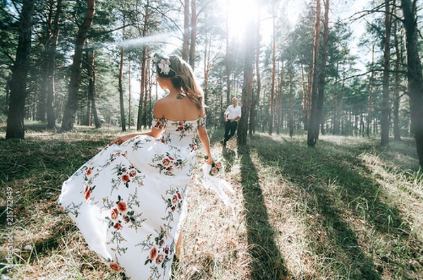 Fototapeta bride and groom in the forest