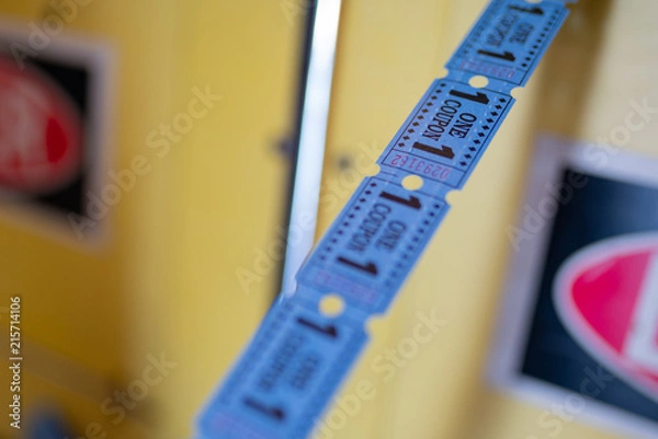 Fototapeta Line of tickets from arcade game center showing one coupon.