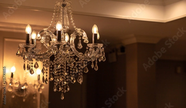 Fototapeta Chrystal chandelier lamp on the ceiling in Dining room Adjusting the image in a Luxury tone .Decorative elegant vintage and Contemporary interior Concept.