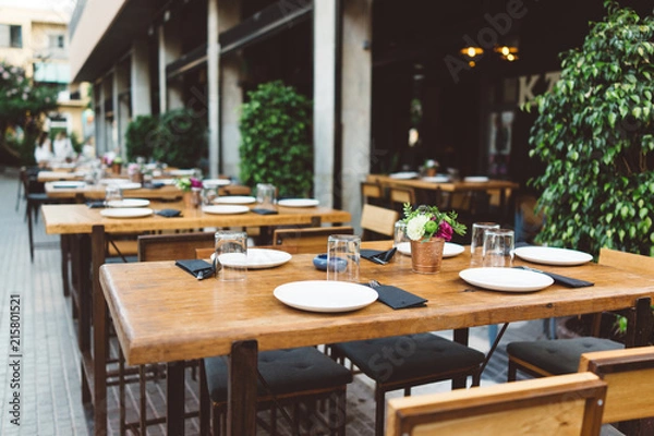 Obraz Dish on the wooden table in outdoor restaurant