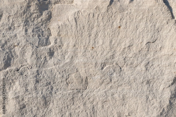 Fototapeta Background geology closeup limestone rock face showing weathered strata wallpaper