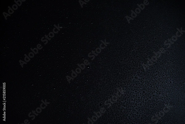 Obraz Drops of water on black background.