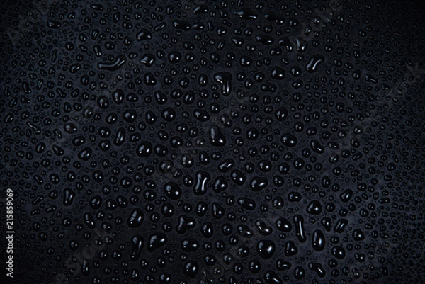 Obraz Drops of water on black background.