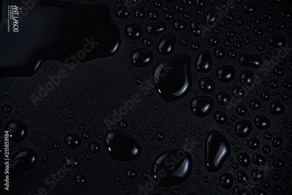 Fototapeta Drops of water on black background. isolated background and texture