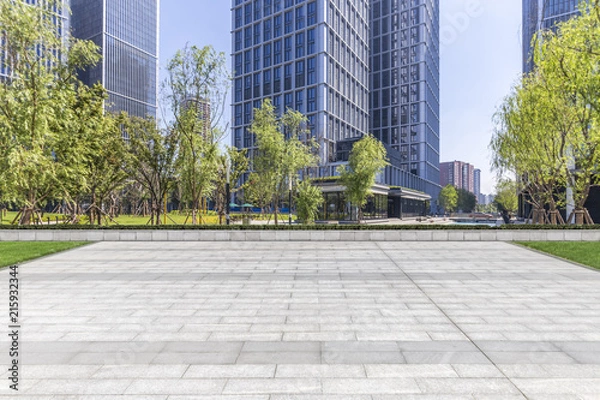 Fototapeta Panoramic skyline and modern business office buildings with empty road,empty concrete square floor
