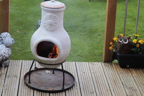 Fototapeta stone garden chimenea for heat on a summers evening