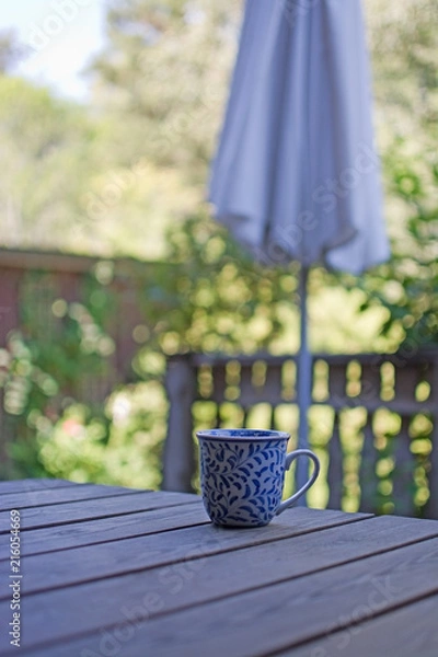 Obraz Mug in blue pattern on wooden table