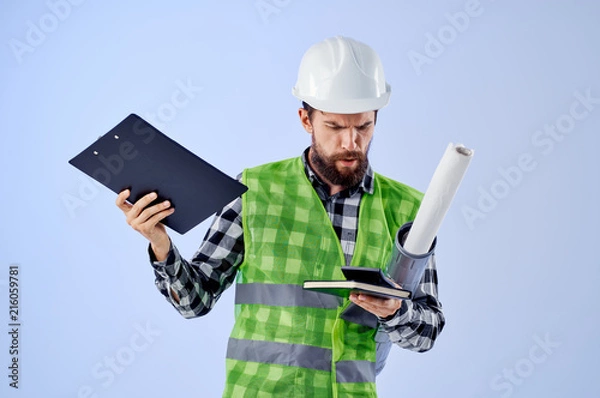 Fototapeta builder in a helmet with drawings