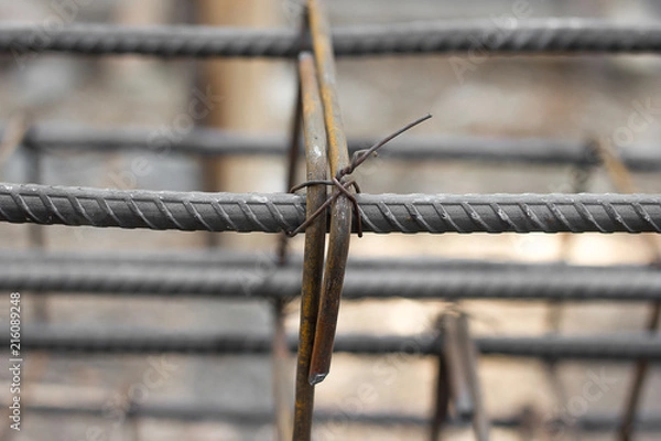 Obraz Reinforcing steel bars for building structure at construction site.