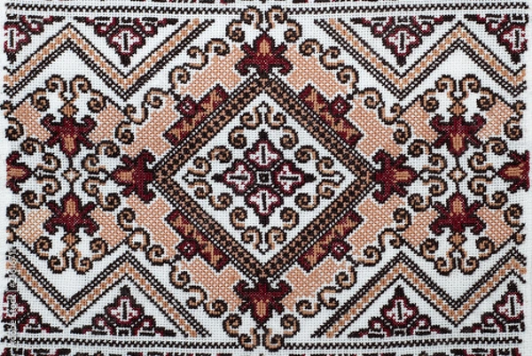 Fototapeta embroidered handmade good by cross-stitch pattern