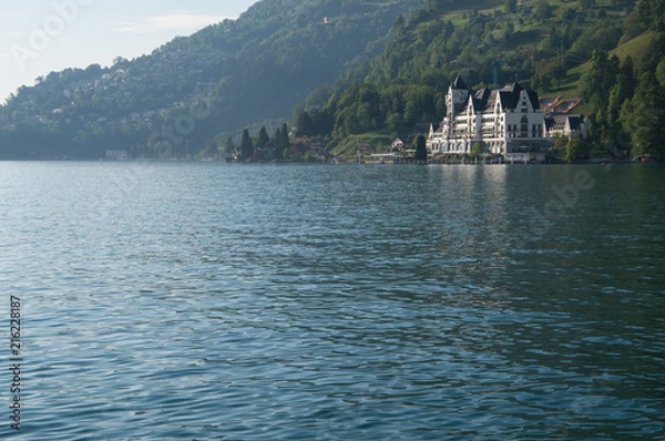 Obraz Large hotel by the water in the swiss alps