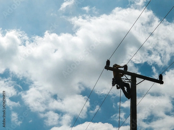 Fototapeta The lineman resolving power failure.