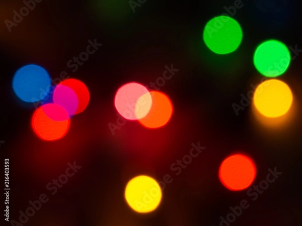 Fototapeta Detail of a Christmas lights abstract background on black