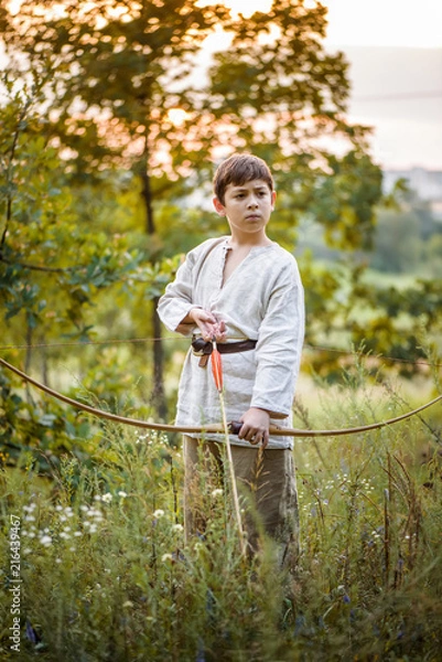 Fototapeta Young boy with a bow