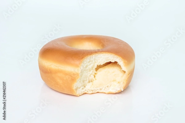 Fototapeta Bite marks on donuts on white background
