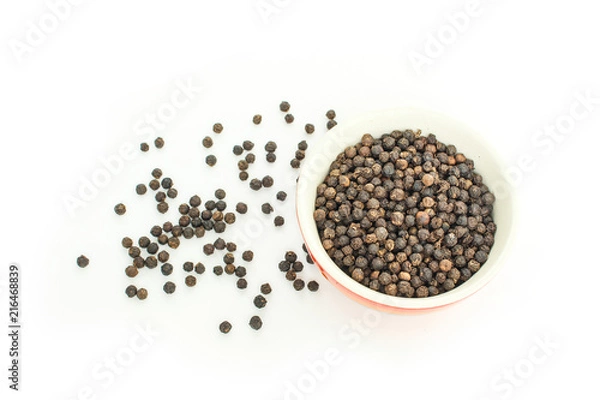 Fototapeta peppercorns in bowl on white background.