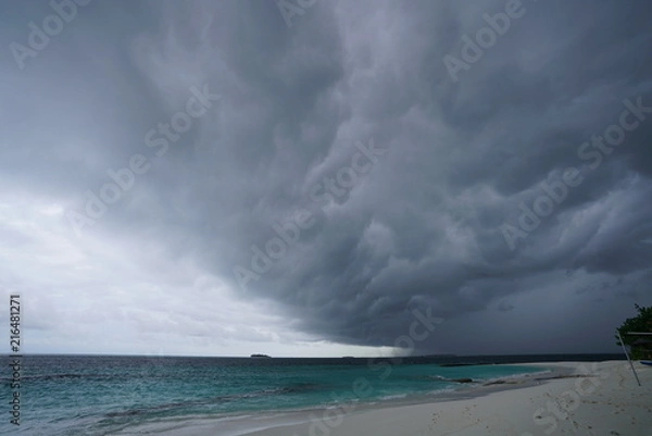 Obraz View of the beautiful beach with turquoise colored water during monsoon season in The Maldives
