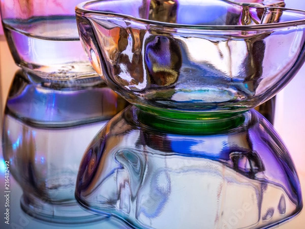 Fototapeta Glass of water with drop and colored background