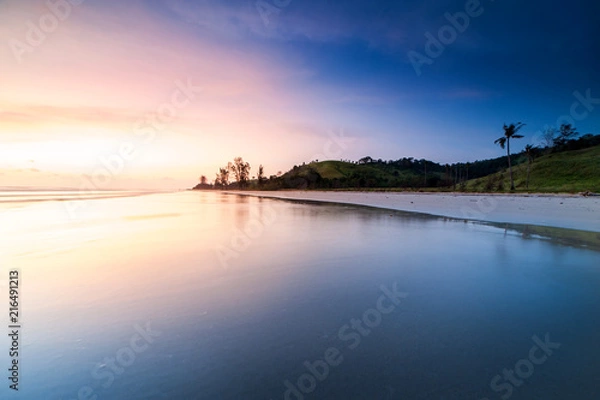 Fototapeta beautiful sunset at the beach with reflection. 