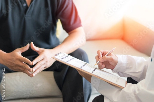 Fototapeta Urologist Doctor giving consult for prostate problems to patient. Urologic oncologists specialize in treating cancer of the urinary tract and male reproductive organs. Mens health problem concept.