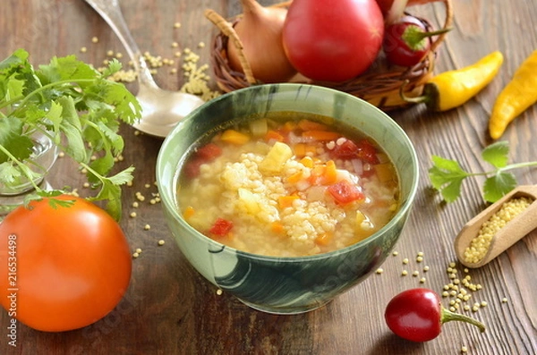 Fototapeta Soup with millet and vegetables, vegetarian